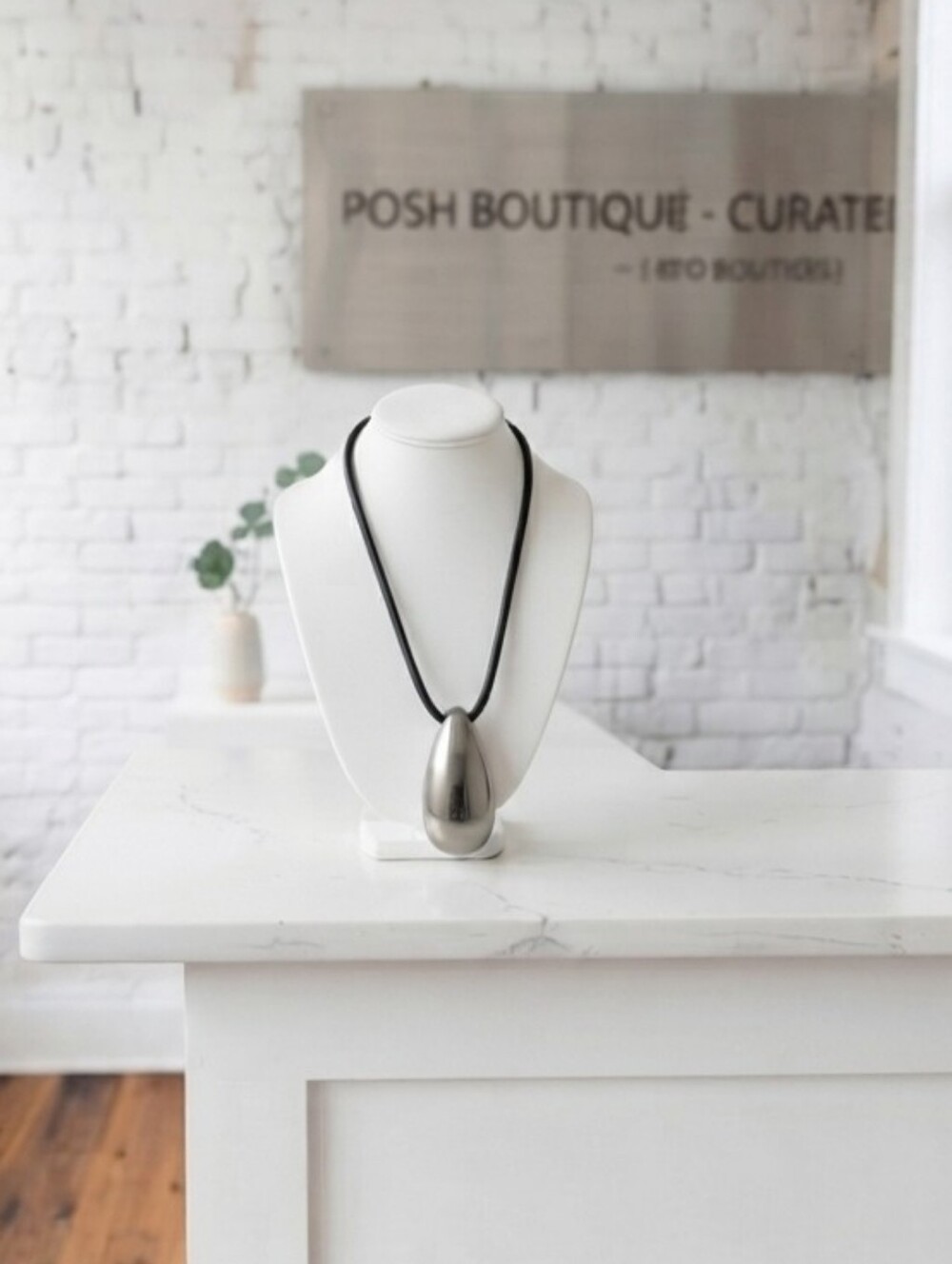 Sleek Silver Teardrop Pendant Necklace on Black Cord